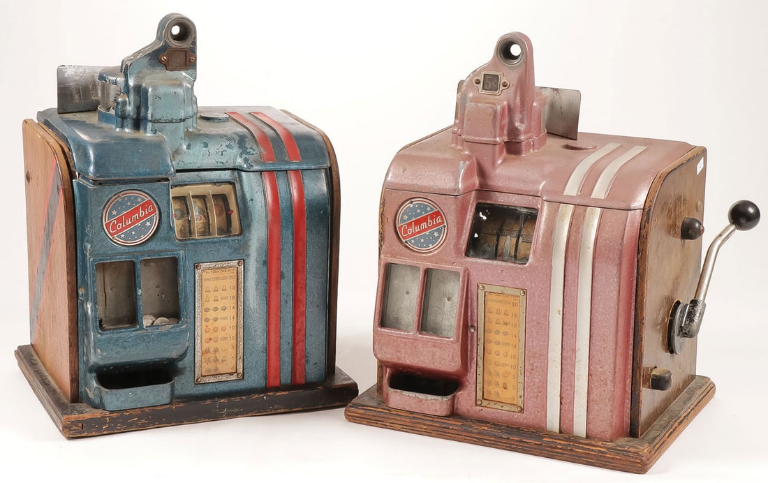 PAIR OF COLUMBIA 5 CENT SLOT MACHINES: PAIR OF COLUMBIA 5 CENT SLOT MACHINES Neither operable, one missing lever, both without back plates. Height 18 inches each. LOCAL PICKUP OR THIRD PARTY SHIPPER ONLY. SHIPPING NOTICE: Jackson's is your