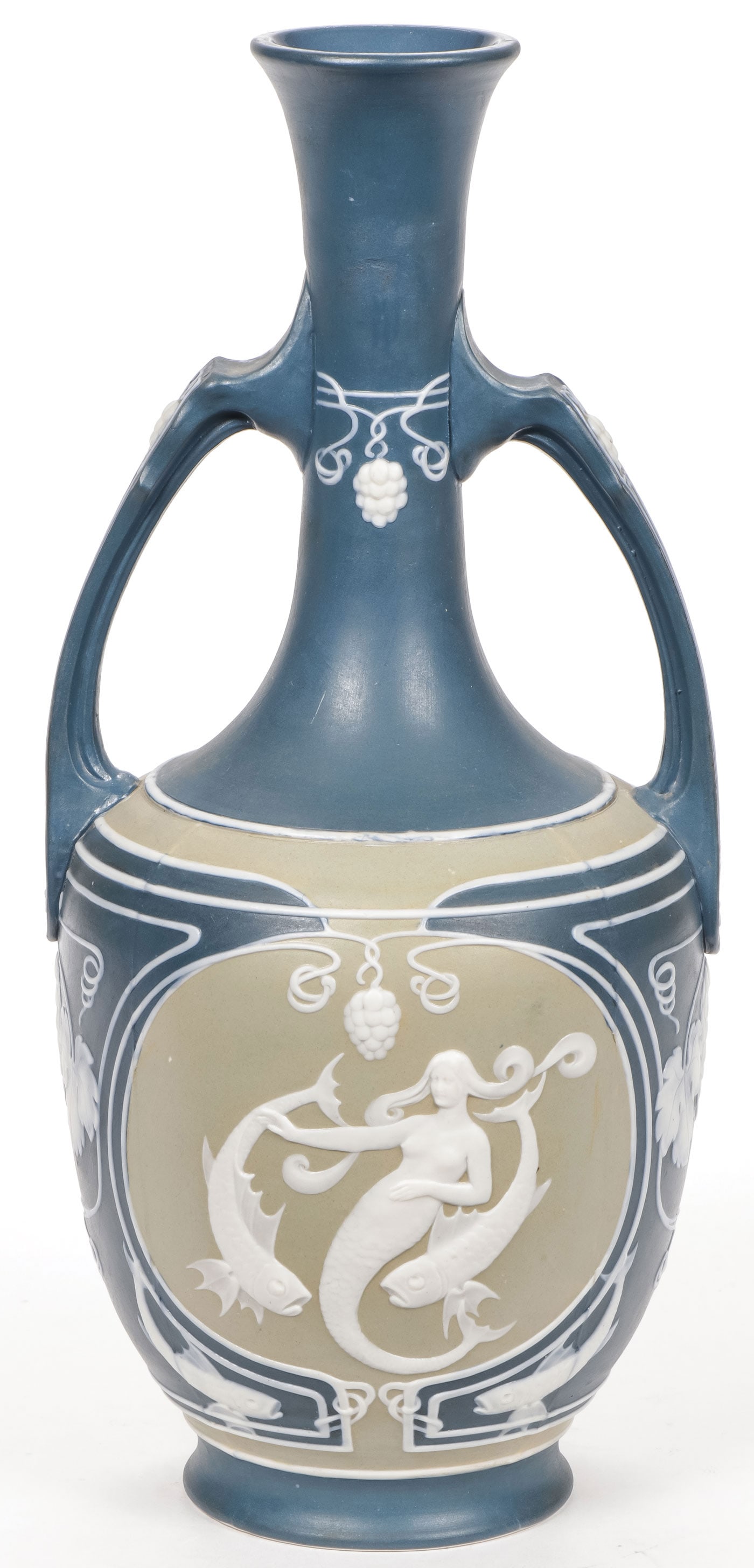 METTLACH ART NOUVEAU MERMAID VASE: METTLACH ART NOUVEAU MERMAID VASE The sides with bas relief sculpted mermaids, fish and grapevines with double handles and flared mouth impressed Mettlach castle mark, mold No. 3006, date stamp 96. He