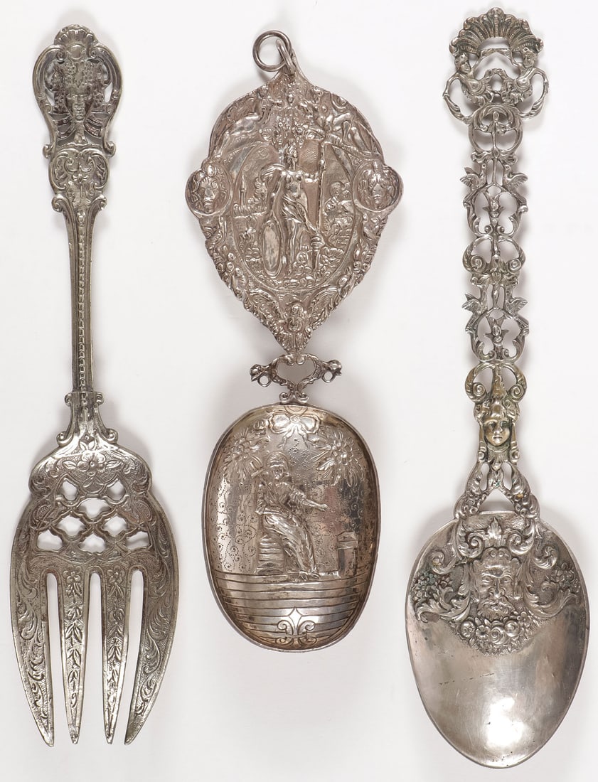 SILVER SPOONS & PLATED FORKS: SILVER SPOONS & PLATED FORKS Comprising a pair of large decorative 800 silver spoons, one with large shield form handle with Minerva, and a silver plated serving fork marked made in Italy, silver weig