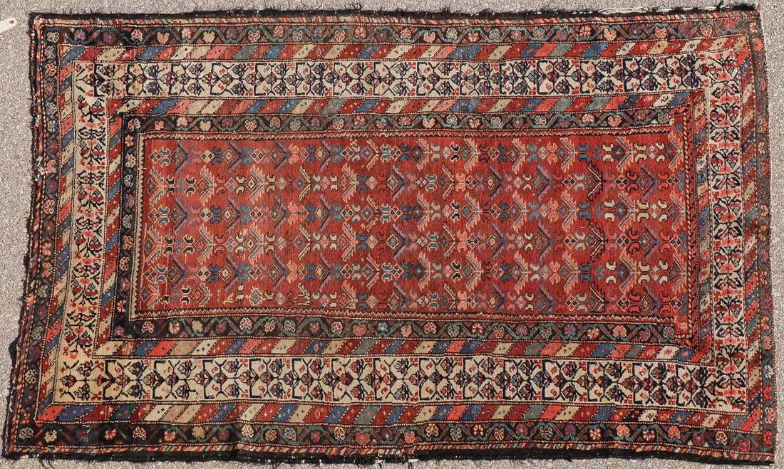 ANTIQUE CAUCASIAN SHIRVAN RUG CIRCA 1925: ANTIQUE CAUCASIAN SHIRVAN RUG CIRCA 1925 Having an all over repeating stylized floral shield motif on rust ground with fourteen borders, 51 inches x 78 inches. SHIPPING NOTICE: Jackson's is your sole