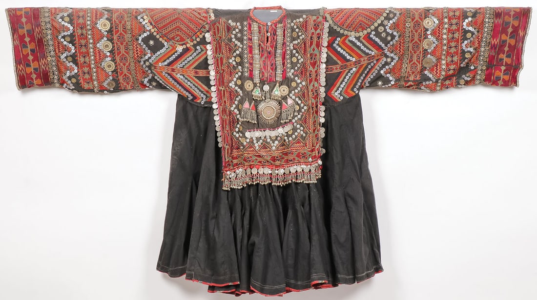 COLORFUL SWAT KHOISTAN WEDDING DRESS: COLORFUL SWAT KHOISTAN WEDDING DRESS Of traditional design with colorful and heavily embroidered sleeves, bodice, and profusely decorated with coins, medallions, and other decorative elements as shown