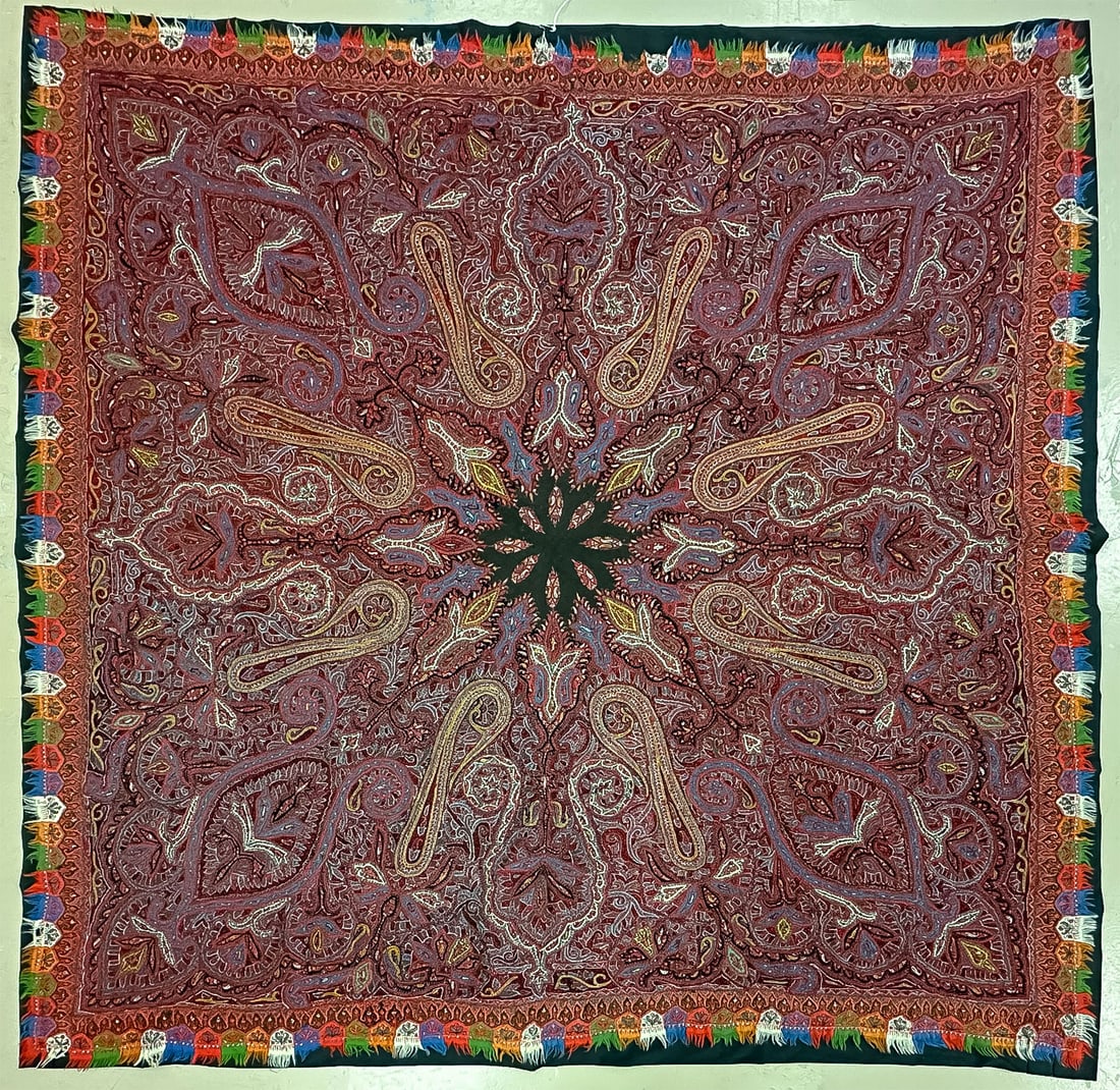 FINE EMBROIDERED KASHMIR PAISLEY SHAWL: FINE EMBROIDERED KASHMIR PAISLEY SHAWL. The square shawl hand embroidered with intricate detail having black central medallion and vibrant floral and foliate tabbed border, 68 inches x 68 inches. SHIP