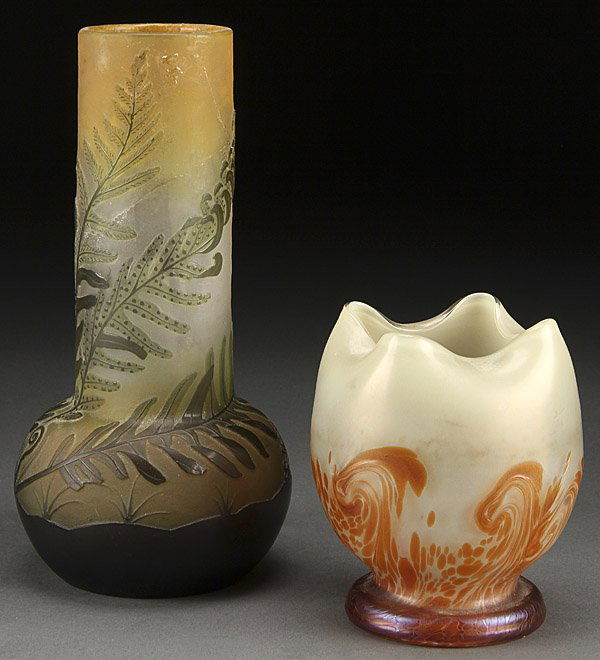 GALLE CAMEO GLASS AND LOETZ STYLE ART GLASS VASES: GALLE CAMEO GLASS AND LOETZ STYLE ART GLASS VASES, CIRCA 1900. The Galle with cut fern decoration (damaged), the Loetz style with amber oil spot finish over an opalescent body with crimped rim. Height