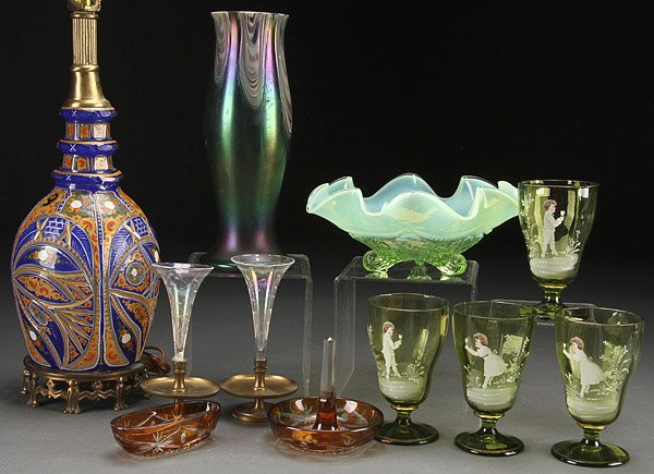 A VICTORIAN DECORATIVE GLASS GROUP: A VICTORIAN DECORATIVE GLASS GROUP, MID 19TH/EARLY 20TH CENTURY. Comprising a polychrome cut overlay glass decanter converted to a lamp, Bohemian glass vase, four Mary Gregory style goblets, a cut ove