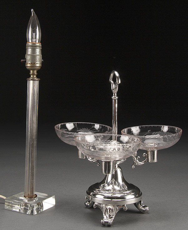 A SILVER PLATE AND ETCHED CRYSTAL EPERGNE: A SILVER PLATE AND ETCHED CRYSTAL EPERGNE, EARLY 20TH CENTURY. Comprising a center handled scroll footed stand containing three etched crystal flower bowls, together with a crystal Boudoir lamp. The l