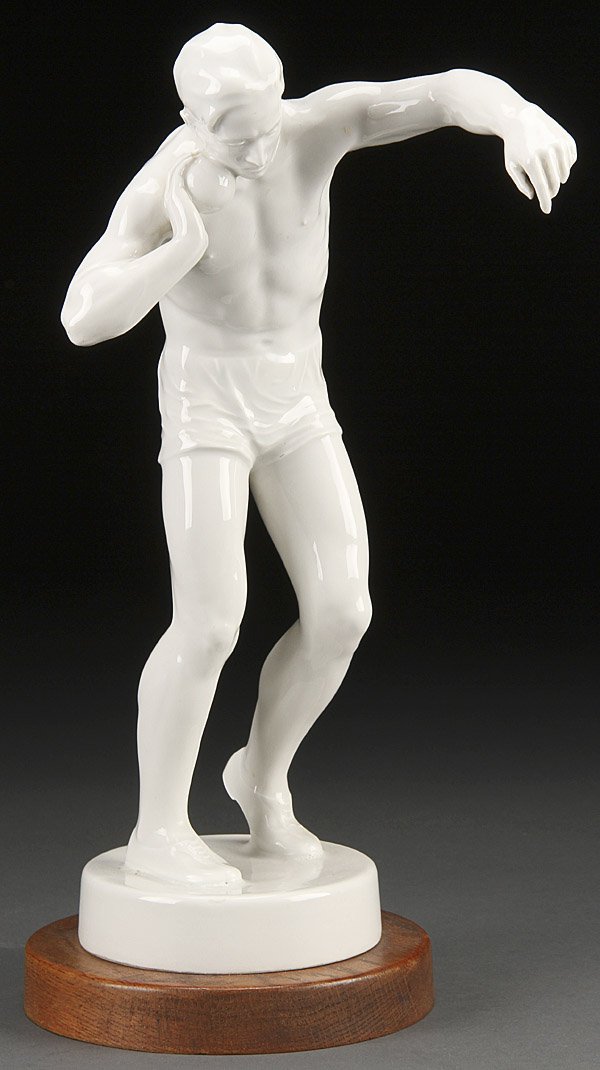 MEISSEN PORCELAIN MODEL OF SHOT-PUTTER: A MEISSEN PORCELAIN MODEL OF AN OLYMPIC SHOT-PUTTER, CIRCA 1936. Possibly for the 1936 Olympics. Blue underglaze crossed swords with two cancellation marks. Height of porcelain 12.75 inches (32.5 cm).