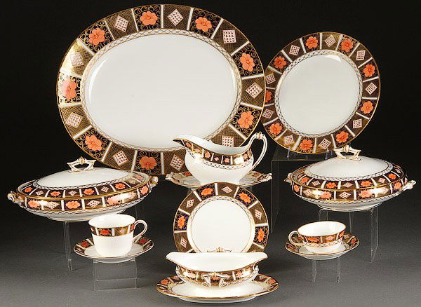 A ROYAL CROWN DERBY "IMARI" PARTIAL DINNERWARE SET: A ROYAL CROWN DERBY "IMARI" PARTIAL DINNERWARE SET, 20TH CENTURY. Comprising twelve 10.5 inch (26.5 cm) plates, six saucers, six teacups and one each; sauce dish, coffee cup and saucer, salad plate,
