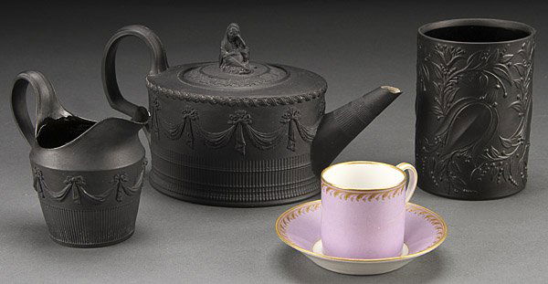 A FOUR PIECE PORCELAIN GROUP, 19TH/20TH CENTURY: A FOUR PIECE PORCELAIN GROUP, 19TH/20TH CENTURY. Comprising a basaltware teapot and matching cream jug with embossed swags, a Rosenthal tumbler, and a KPM demitasse cup and saucer. The largest 8 inche