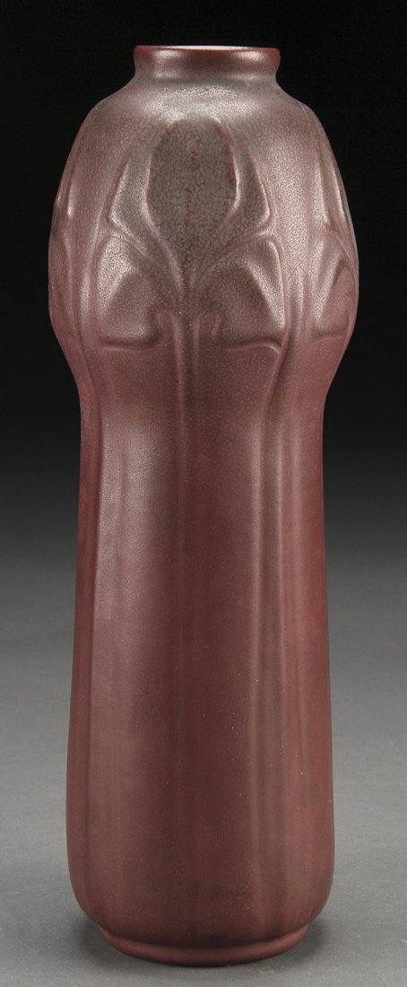 1905 VAN BRIGGLE AMERICAN ART POTTERY VASE: A VERY FINE 1905 DATED VAN BRIGGLE AMERICAN ART POTTERY VASE. Shape number 280 with stylized leaves and elongated stems under a purple rose matte glaze with bluish gray overspray. Incised logo, name,