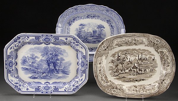THREE ENGLISH STAFFORDSHIRE TRANSFERWARE PLATTERS: THREE ENGLISH STAFFORDSHIRE TRANSFERWARE PLATTERS, 19TH CENTURY. Comprising "Damascus", "Ridgways Grecian", and an unidentified country farm scene. The largest length 19 inches (48 cm).