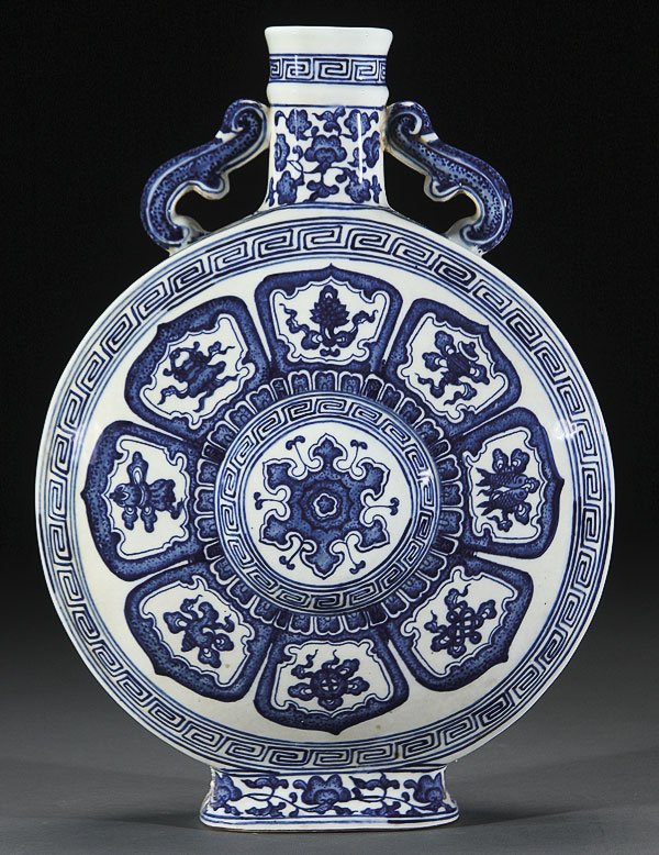 CHINESE MING STYLE BLUE/WHITE MOON FLASK: A CHINESE MING STYLE BLUE AND WHITE PORCELAIN MOON FLASK. Finely painted in blue underglaze with a rosette of eight stylized lotus petals each containing auspicious Buddhist symbols within an interloc