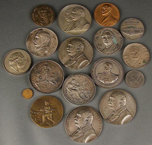 ARGENTINIAN MEDALLIONS, 15 PIECES, BRONZE/SILVER: A GROUP OF 15, MOSTLY ARGENTINIAN BRONZE AND SILVER MEDALLIONS, EARLY 20TH CENTURY. Comprising two Dr. Saenz Pena inaugural and commemorative silver medallions stamped "plata" and 13 silver/bronze or 