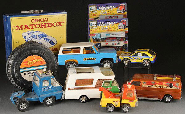 A VINTAGE STRUCTO TONKA AND DIECAST TOY GROUP: A VINTAGE STRUCTO TONKA AND DIECAST TOY GROUP, MOSTLY LAST QUARTER 20TH CENTURY. Comprising a Tonka camper truck, Buddy-L Blazer, Auburn motorcycle cup, Matchbox and Hot Wheels case, 1967 and 1968 Mat
