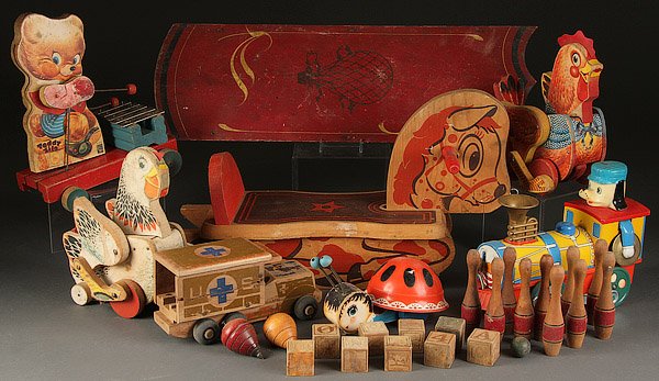 A FISHER PRICE AND OTHER WOODEN TOY GROUP: A FISHER PRICE AND OTHER WOODEN TOY GROUP, MID 20TH CENTURY. Comprising six pull toys with Fisher Price No. 777, 140 and 120 together with a Japanese battery-operated locomotive, Holgate army medical 
