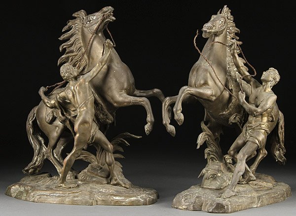 BRONZE MARLEY HORSES, COUSTOU: After GUILAUME COUSTOU (French 1677-1746) A Pair of Marley Horses Bronze with verdi gras patina Inscribed on one base “Coustou” Height 19 inches (48.3 cm)