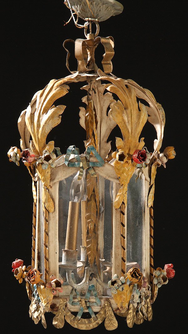 A POLYCHROME TIN FLORAL DECORATED PENDANT LAMP: A POLYCHROME TIN FLORAL DECORATED PENDANT LAMP. With pentagon glazed panels and extending foliate decoration. Length 24 inches (61 cm).