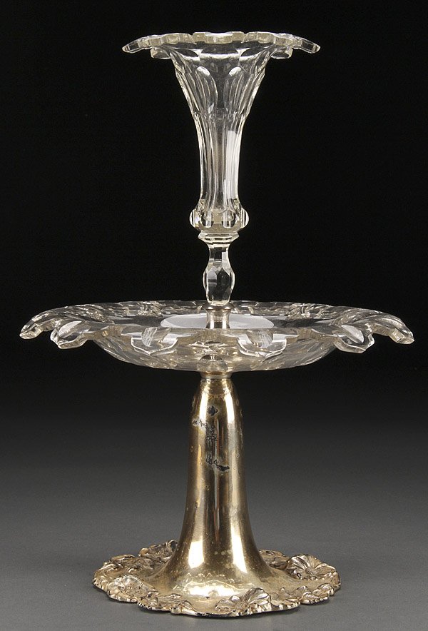 AMERICAN CENTERPIECE EPERGNE: A FINE AMERICAN QUADRUPLE PLATE AND CUT GLASS CENTERPIECE EPERGNE, THIRD QUARTER 19TH CENTURY. By Delphi Silver Co. with flaring floral relief base supporting a cut glass low bowl with center lily for