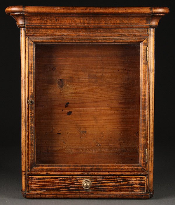 A RUSSIAN ICON SHADOW BOX FRAME (KIOT), CIRCA 1860: A RUSSIAN ICON SHADOW BOX FRAME (KIOT), CIRCA 1860. With glazed hinged door above lower pull out drawer, interior opening 16.8 inches x 14.75 inches (42.5 x 37.5 cm), overall size 23.5 inches x 20.25 