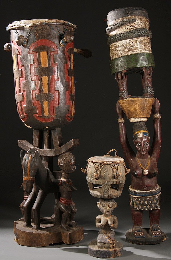 A GROUP OF THREE LARGE CARVED WOOD AFRICAN TABLES: A GROUP OF THREE LARGE CARVED WOOD AFRICAN TABLES/DRUMS. Comprising Baga style tables/drums all with polychroming. Greatest height 61 inches (155 cm).
