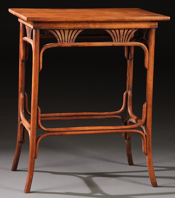 AN AUSTRIAN THONET BENT WOOD SIDE TABLE: AN AUSTRIAN THONET BENT WOOD SIDE TABLE, CIRCA 1900. With scrollwork fan shaped skirt below a rectangular top raised on bentwood legs, original Thonet paper label. Height 27.75 inches, width 22.75 inc