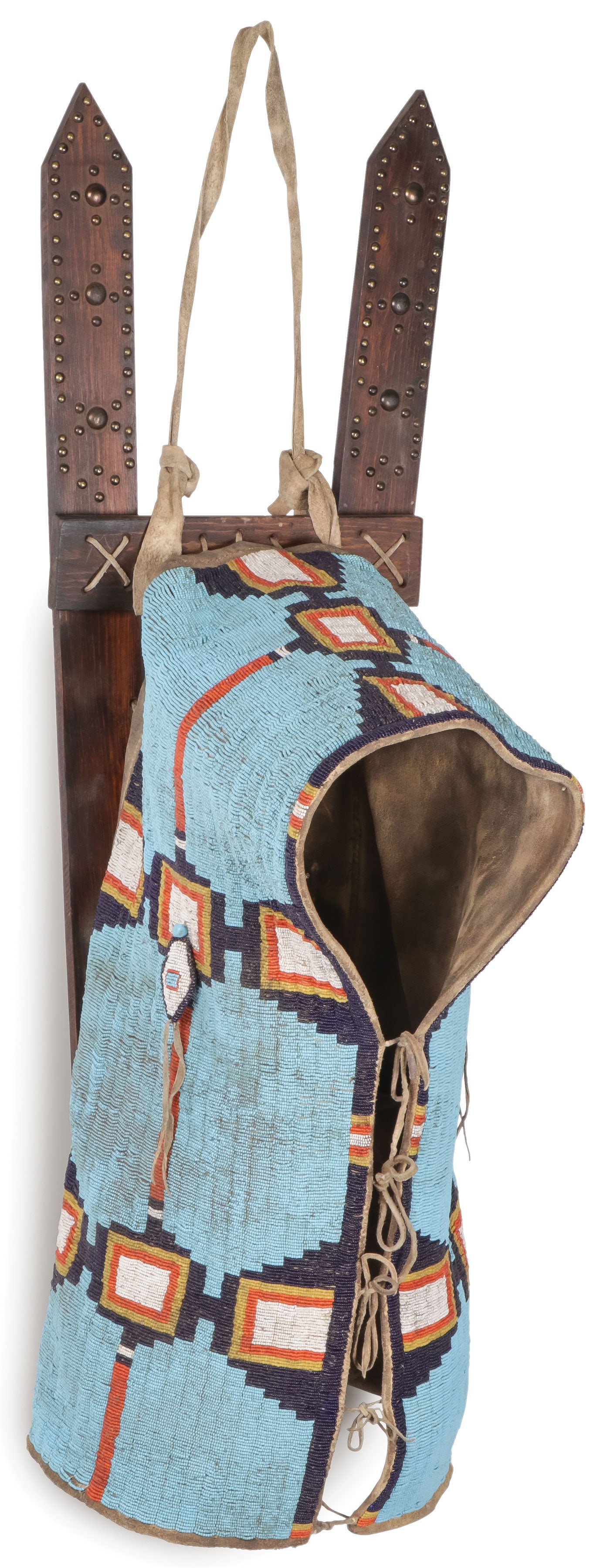 VERY FINE PLAINS BEADED CRADLE COVER, 20TH C: VERY FINE PLAINS BEADED CRADLE COVER, 20TH C. Sinew-sewn, tanned buffalo hide. Profusely beaded with geometric patterns on a predominately blue field, lazy-stitch sewn and with padded diamond shaped d