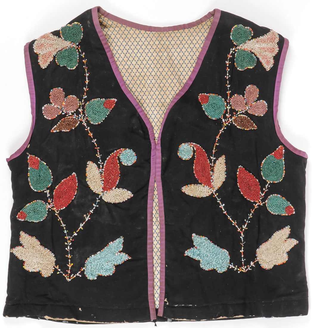 A GREAT LAKES BEADED MAN'S VEST, CIRCA 1900: A GREAT LAKES BEADED MAN'S VEST, CIRCA 1900. Overall beaded with floral designs, with purple silk piping and lined with calico. 22.25 inches x 21 inches. SHIPPING NOTICE: Except for large, oversized