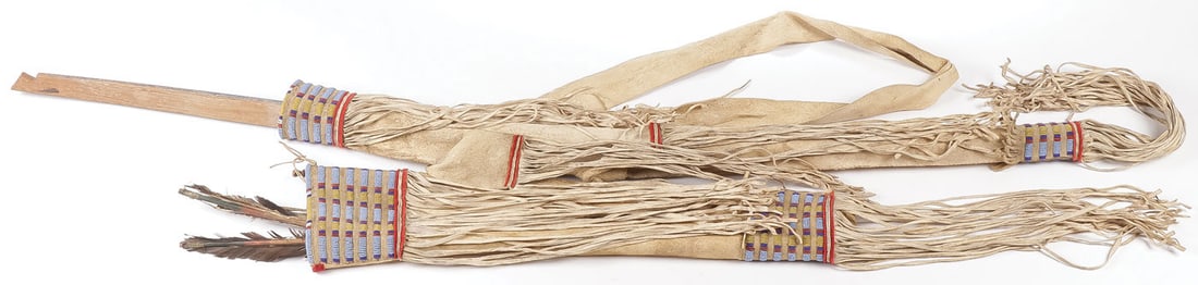 A PLAINS BEADED BOW, QUIVER & ARROWS, C. 1890: A PLAINS BEADED BOW, QUIVER & ARROWS, C. 1890. Of traditional form, native tanned hide, sinew-sewn, with lazy-stitched beaded banding, red wool trade cloth and fringe drops and original tanned carryin