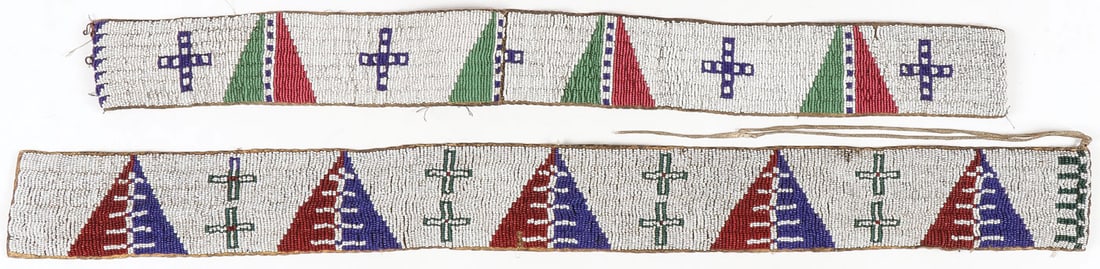 PR OF PLAINS BEADED BELTS, C. 1875: PR OF PLAINS BEADED BELTS, C. 1875. Overall beaded with geometric and cross patterns, lazy-stitch and sinew-sewn. Greatest length 28.25 inches. SHIPPING NOTICE: Except for large, oversized items, Jac
