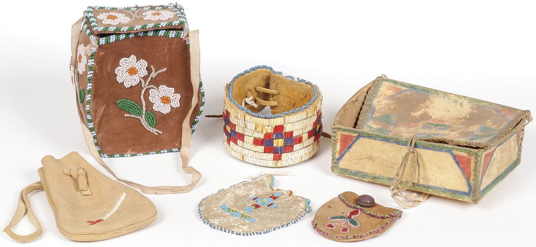 GREAT LAKES AND PLAINS CONTAINERS: GREAT LAKES AND PLAINS CONTAINERS. Comprising six individual pieces including a good Sioux parfleche polychrome box, circa 1900, two beaded pouches, a tobacco pouch with quilled pipe decoration, a Gre