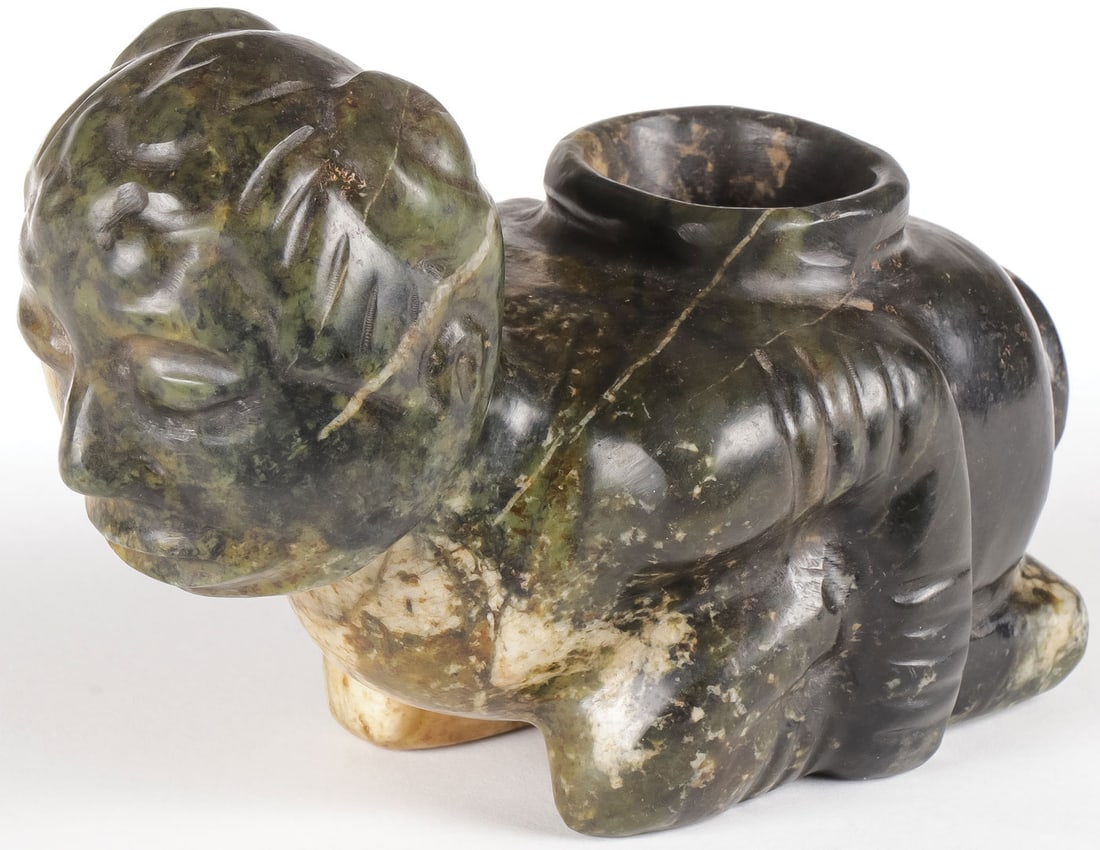 INTERESTING CARVED EFFIGY PIPE: INTERESTING CARVED EFFIGY PIPE. Comprising a large and impressive squatting human form carved stone pipe bowl, unknown culture an age. Length 6.5 inches. SHIPPING NOTICE: Except for large, oversized i