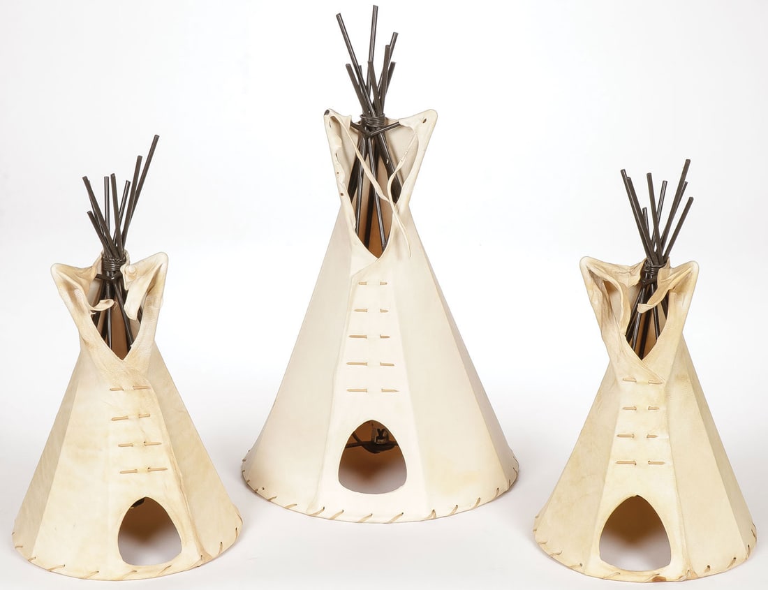 THREE HIDE TEEPEE LAMPS: THREE HIDE TEEPEE LAMPS. Comprising three attractive contemporary hide-cover tabletop lamps with metal frames, as shown. Greatest height 17.25 inches. SHIPPING NOTICE: Except for large, oversized ite