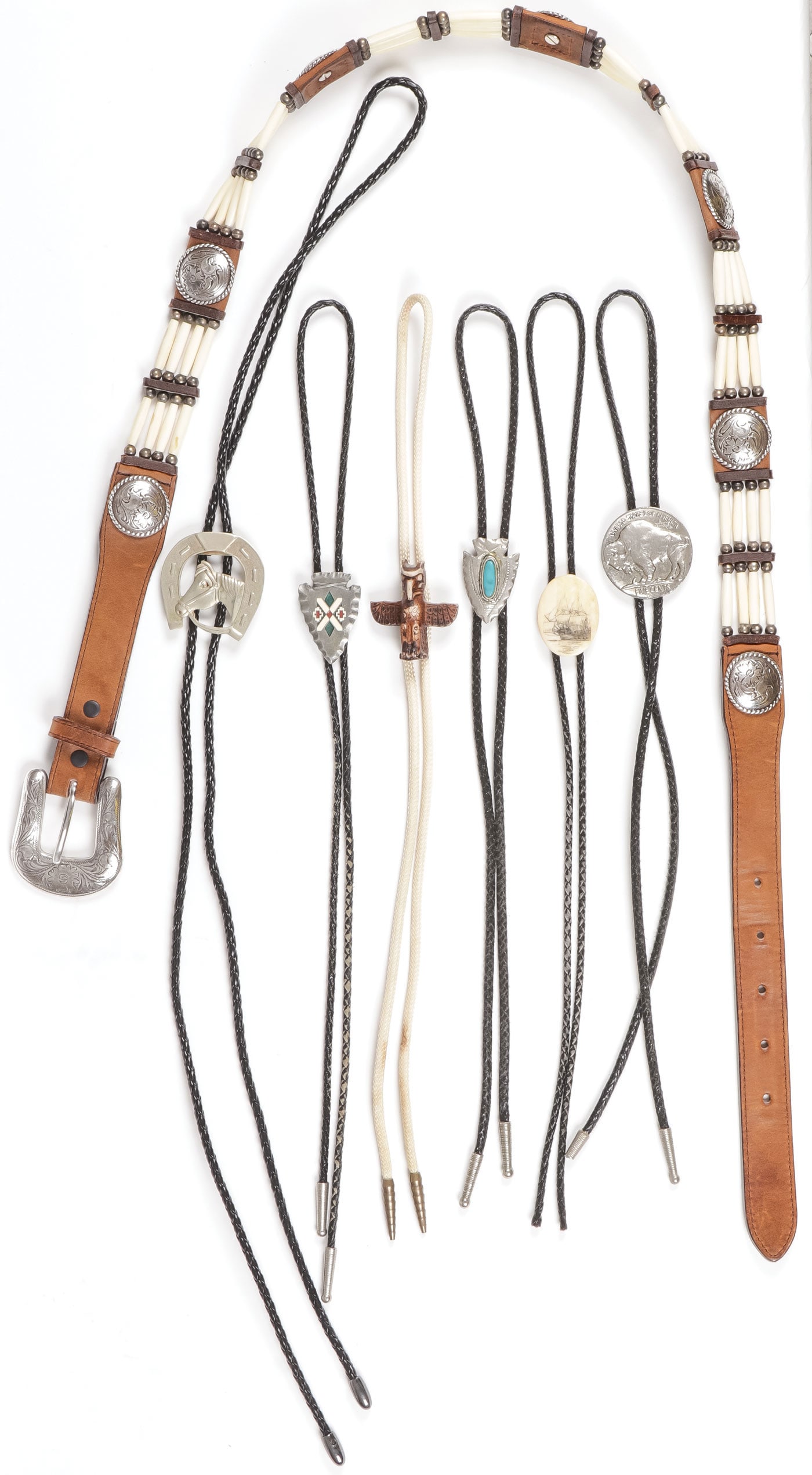 TONY LAMA BELT & BOLOS: TONY LAMA BELT & BOLOS. Comprising six bolos, each with different slides, and a concho style belt with bone tube beads. Marked Tony Lama. Belt 38-inch waist SHIPPING NOTICE: Except for large, oversize