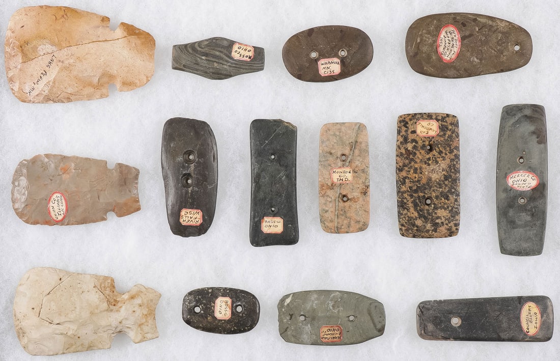 FOURTEEN STONE TOOLS & PENDANTS: FOURTEEN STONE TOOLS & PENDANTS. Including three Woodland period blades and various gorgets and pendants, both hard and soft-stone examples. Most with collection labels, some possibly prehistoric, oth