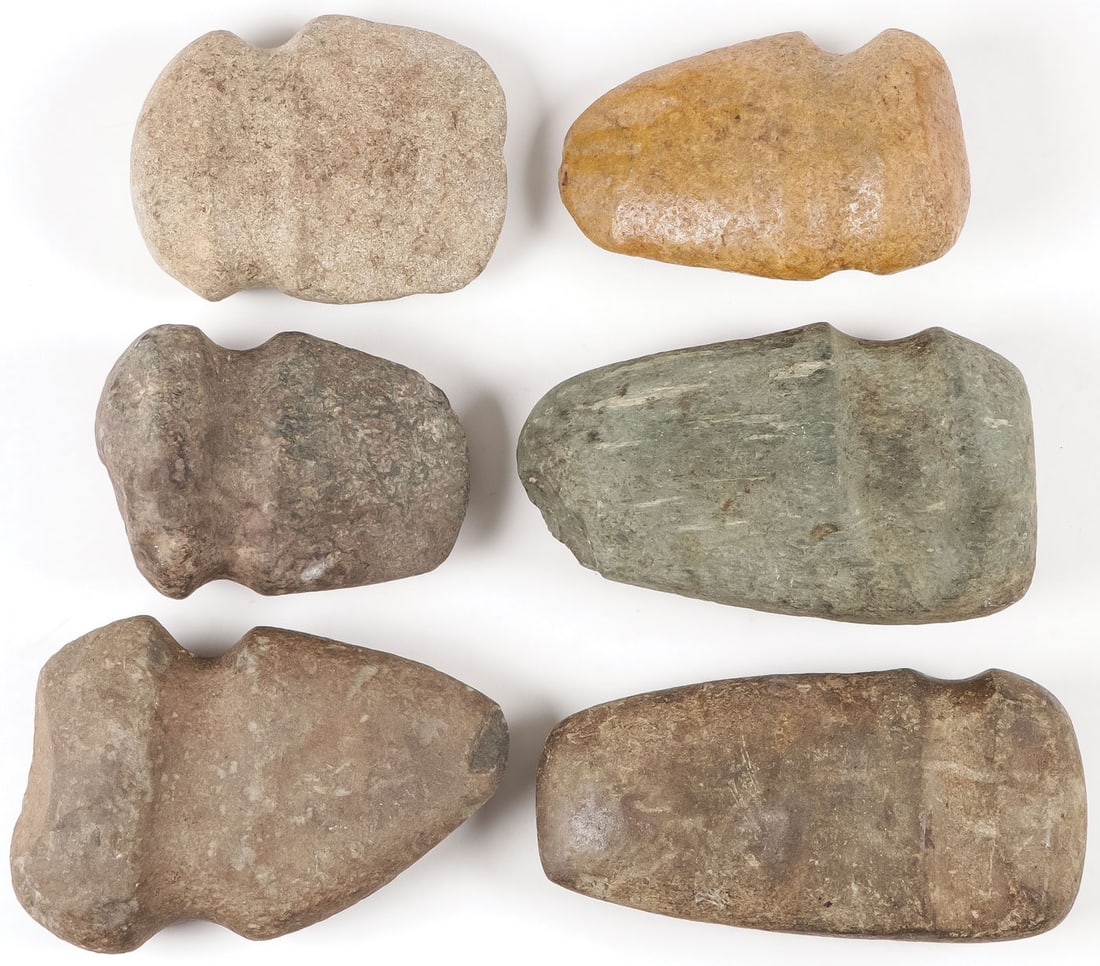 SIX STONE AXE HEADS: SIX STONE AXE HEADS. Including full groove and three-quarter groove examples in various states of condition. Greatest length 7.5 inches. SHIPPING NOTICE: Except for large, oversized items, Jackson's