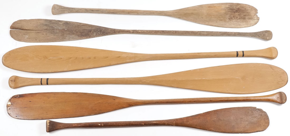 6 HAND CARVED WOOD PADDLES: 6 HAND CARVED WOOD PADDLES. Including a matching pair. Greatest length 61 inches. SHIPPING NOTICE: Except for large, oversized items, Jackson's is your sole and only source for one stop packing and sh