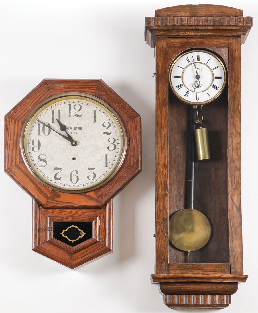 A PAIR OF OAK WALL REGULATORS: A PAIR OF OAK WALL REGULATORS. Greatest height 38 inches.SHIPPING NOTICE:Except for large, oversized items, Jackson's is your sole and only source for one stop packing and shipping. With over 50 yea