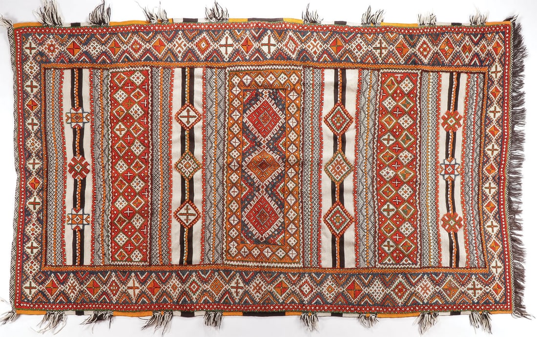 PAIR OF MOROCCAN BERBER CARPETS: PAIR OF MOROCCAN BERBER CARPETS. Both of traditional design and in excellent condition. The larger example with fringe edging measuring 104 x 59 inches, the other measuring 56.5 x 37.25 inches. Togeth