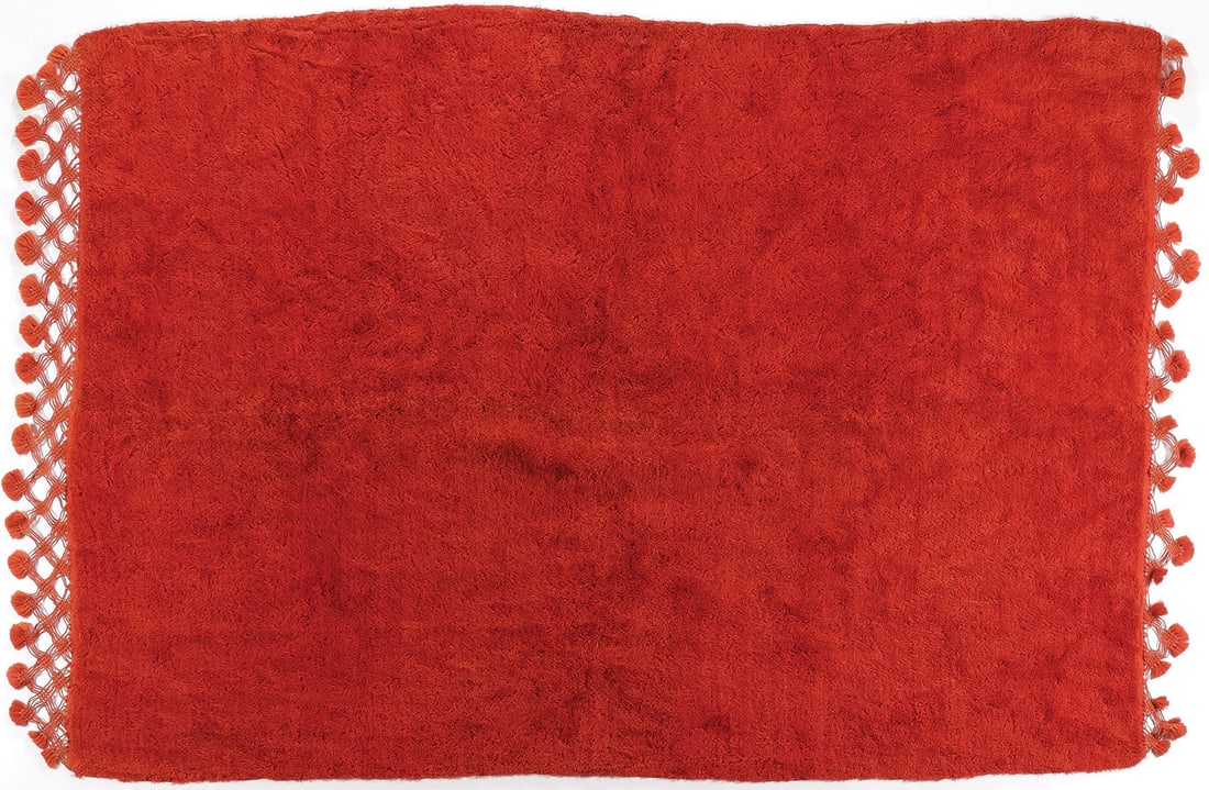 A GREEK RED RUG WITH FRINGE ENDS, C. 1940: A GREEK RED RUG WITH FRINGE ENDS, C. 1940. Measuring 77 inches x 54 inches. Together with a finely woven two-piece joined textile in red and white checkered pattern with lace trim, culture unknown, 91