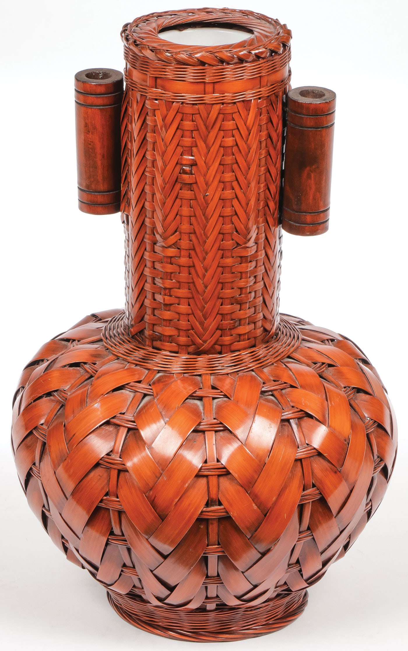 A GOOD JAPANESE WOVEN IKEBANA BASKET: A GOOD JAPANESE WOVEN IKEBANA BASKET. The gourd-form basket with tall neck, opposed tubular handles, and ceramic liner, height 12.4 inches (31.5 cm). SHIPPING NOTICE: Except for large, oversized items