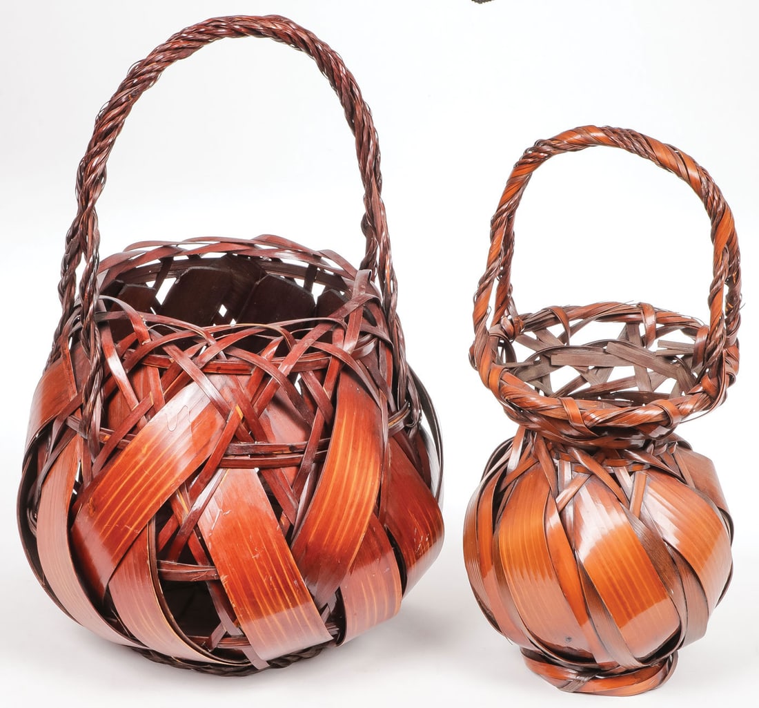 TWO LARGE JAPANESE IKEBANA BAMBOO BASKETS: TWO LARGE JAPANESE IKEBANA BAMBOO BASKETS. Each bamboo woven and brown finished with carrying handles, greatest height 16 inches (40.5 cm). SHIPPING NOTICE: Except for large, oversized items, Jackson'