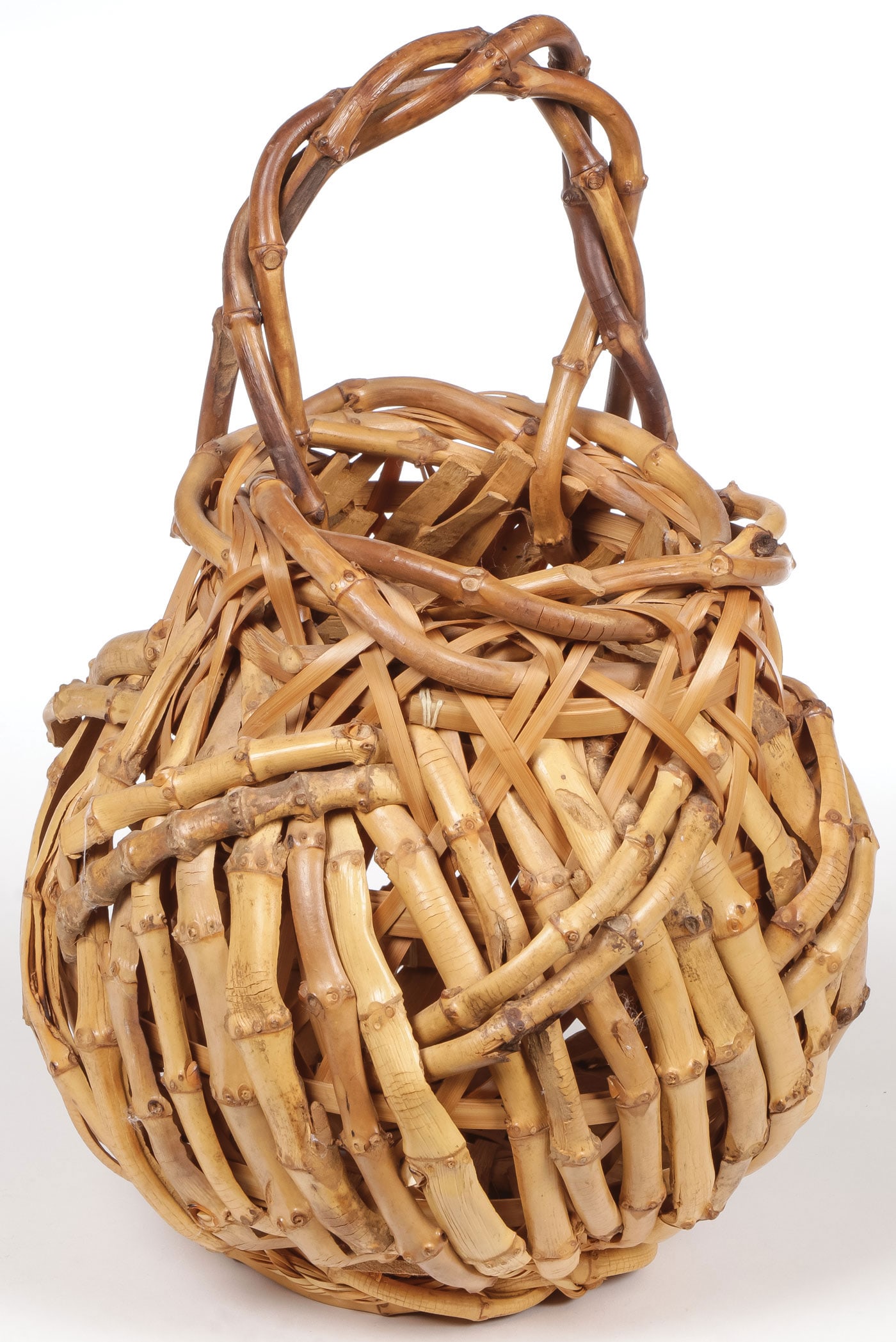 GOOD JAPANESE IKEBANA BAMBOO WOVEN BASKET: GOOD JAPANESE IKEBANA BAMBOO WOVEN BASKET. Woven in split bamboo with twisted branch handle, height 11 inches (28 cm). SHIPPING NOTICE: Except for large, oversized items, Jackson's is your sole and on