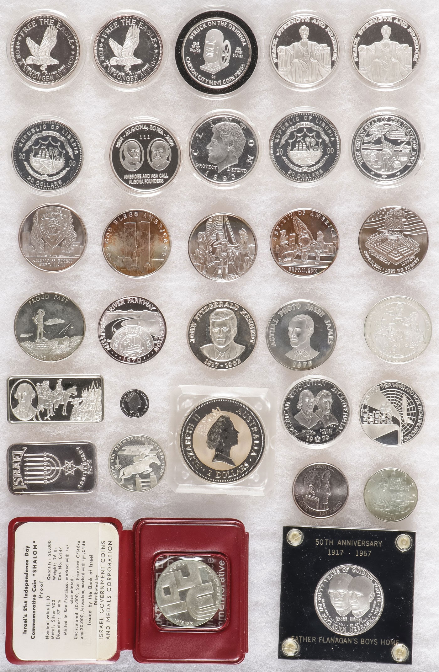 SILVER COMMEMORATIVES COINS AND BULLION: SILVER COMMEMORATIVES COINS AND BULLION. Comprising over 31 individual silver coins, medallions, commemoratives and ingots. Including a 1994 Australian 2 oz, $2 dollars coin, 2 Lincon Memorial commemo