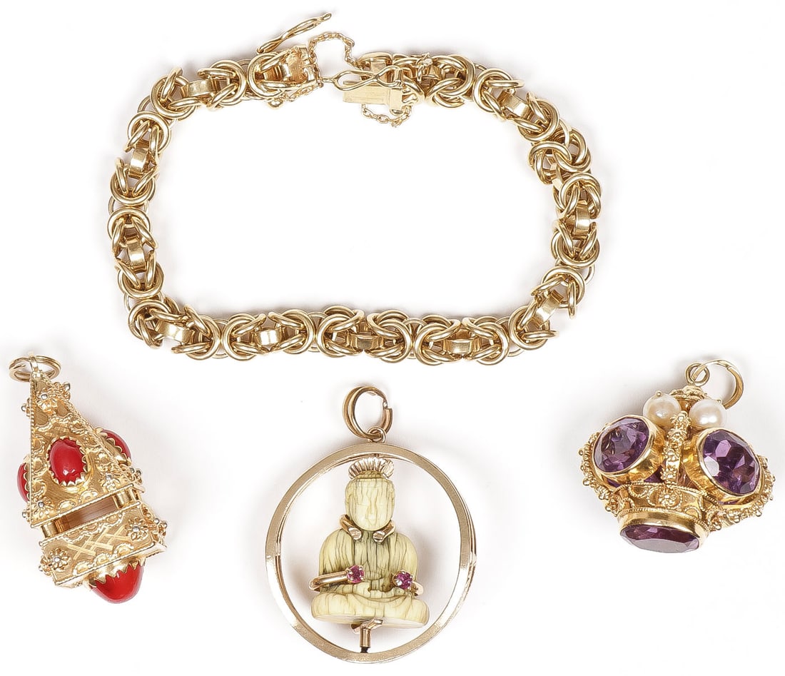 HEAVY GOLD CHARM BRACELET, 104 GRAMS: HEAVY GOLD CHARM BRACELET, 104 GRAMS Comprising a heavy 7-inch multi linked 18K gold bracelet from which is suspended three charms including an 18K gold temple with filigree and coral cabochons, an 18