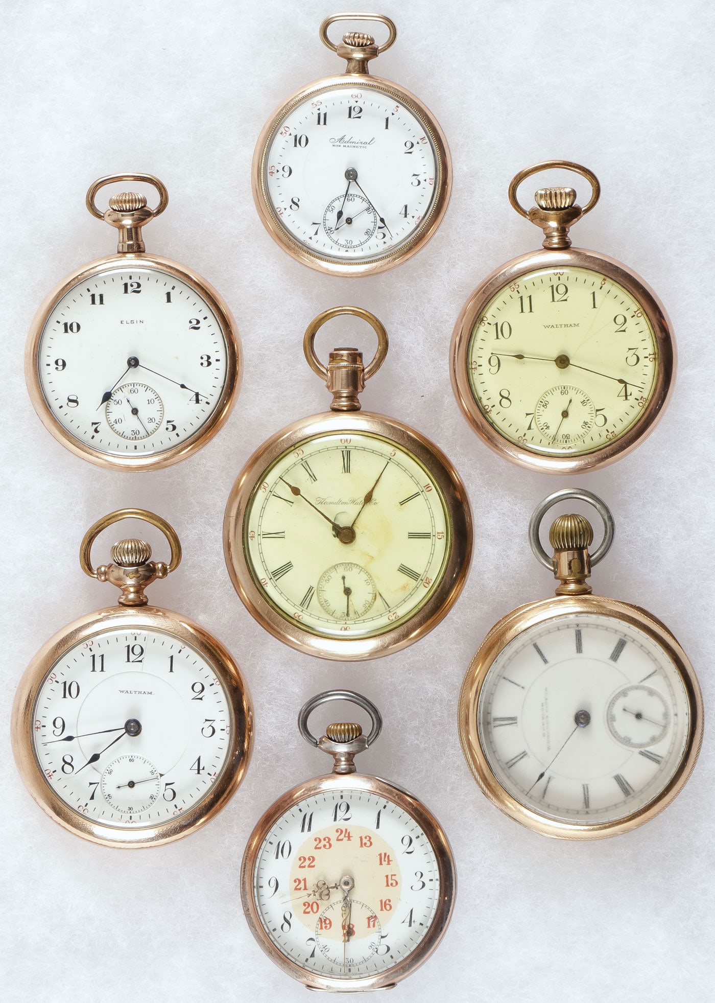 7 VINTAGE OPEN FACE POCKET WATCHES: 7 VINTAGE OPEN FACE POCKET WATCHES. From top to bottom left to right, a Tacy Admiral nonmagnetic open face, white enamel dial, Arabic numerals, subsidiary seconds, 6 jewels, takes a wind and runs, dia