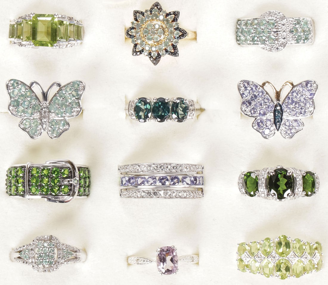 12 STERLING WOMAN'S FASHION RINGS: 12 STERLING WOMAN'S FASHION RINGS. Comprising 12 sterling silver rings set with a variety of precious and semi-precious gemstones, including Russian Diopside, Alexandrite, White Diopside, Tanzanite, W