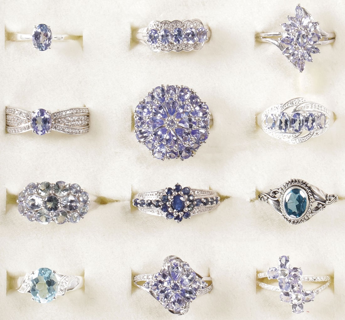 12 STERLING WOMAN'S FASHION RINGS: 12 STERLING WOMAN'S FASHION RINGS. Comprising 12 sterling silver rings set with a variety of precious and semi-precious gemstones, including tanzanite, Kanchanaburi Blue Sapphire, sky blue topaz, and 