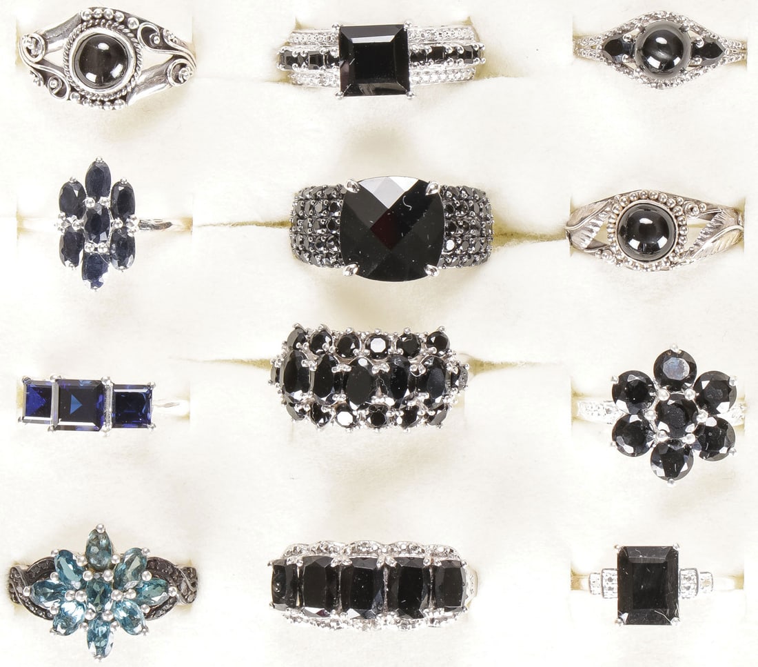 12 STERLING WOMAN'S FASHION RINGS: 12 STERLING WOMAN'S FASHION RINGS. Comprising 12 sterling silver rings set with a variety of semi-precious gemstones, including mostly black spinel, some with accent diamonds, most size 9. SHIPPING NO