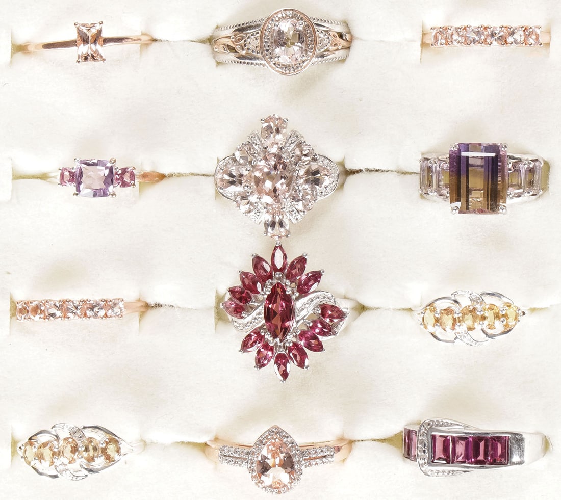 12 STERLING WOMAN'S FASHION RINGS: 12 STERLING WOMAN'S FASHION RINGS. Comprising 12 sterling silver rings, many rose gold plated, set with a variety of precious and semi-precious gemstones, including garnet, topaz, tanzanite, yellow sa