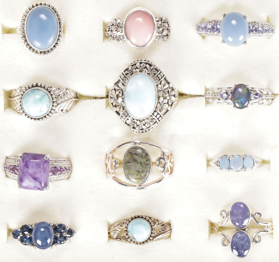 12 STERLING WOMAN'S FASHION RINGS: 12 STERLING WOMAN'S FASHION RINGS. Comprising 12 sterling silver rings set with a variety of semi-precious gemstones, including tanzanite, Thai Blue Star Sapphire, Larimar, Oregon Blue Opal, Peruvian 