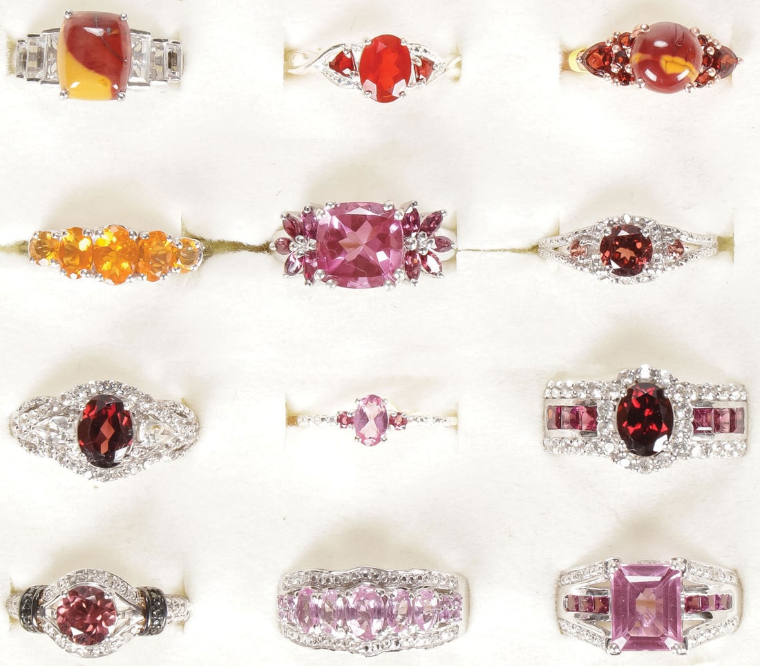 12 STERLING WOMAN'S FASHION RINGS: 12 STERLING WOMAN'S FASHION RINGS. Comprising 12 sterling silver rings set with a variety of precious and semi-precious gemstones, including Umba River Zircon, white topaz, Garnet, Amethyst, Mookaite,